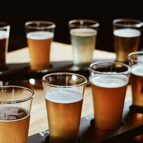 a glass of beer on a table
