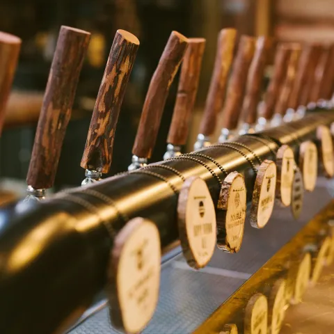 a row of wooden benches sitting on top of a table