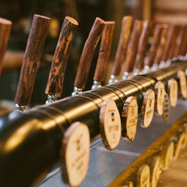 a row of wooden benches sitting on top of a table