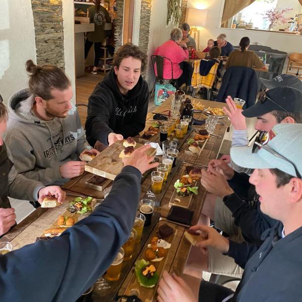 a group of people sitting at a table