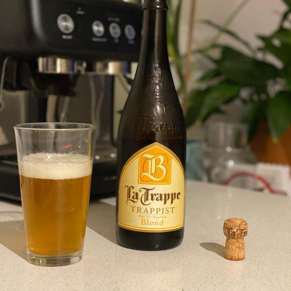 a close up of a bottle and a glass of wine